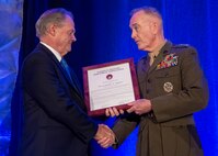 Marine Corps Gen. Joe Dunford, chairman of the Joint Chiefs of Staff, accepts the 2019 Dwight D. Eisenhower award at the National Defense Industrial Association dinner in Arlington, Va., May 10, 2019.