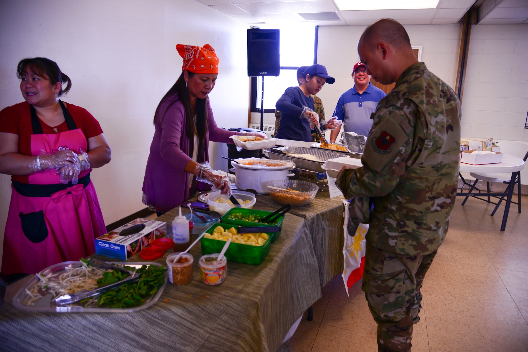 Members of Team Kirtland serve authentic homemade dishes during the Ultimate Noodle Chef Competition, May 10. Col. Richard Gibbs, 377th Air Base Wing Commander,  and other members of Kirtland leadership judged the entries. The competition was held at the Base Chapel to help celebrate Asian American and Pacific Islander Month. Celebrated every May, AAPI Month honors the heritage and culture of Asian and Pacific Islander Americans. This year’s theme is “Unite our Mission By Engaging Each Other.” (U.S. Air Force photo by Jessie Perkins)