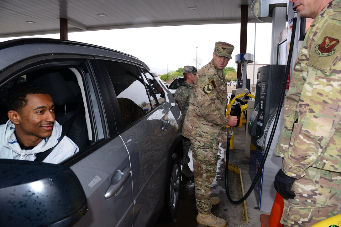 Senior Master Sergeant Daniel Burton, 58th Aircraft Maintenance Squadron, first sergeant and Team Kirtland First Sergeants Council president pumps gas during a random act of kindness event at Kirtland Air Force Base, N.M., May 10. Random acts of kindness is a campaign that strives to increase morale and thank Airmen for their service by distributing First Sergeants Council funds back to the base community. They gave over 500 dollars worth of gas to Airmen E-4 and below during the event. (U.S. Air Force photo by Jessie Perkins)