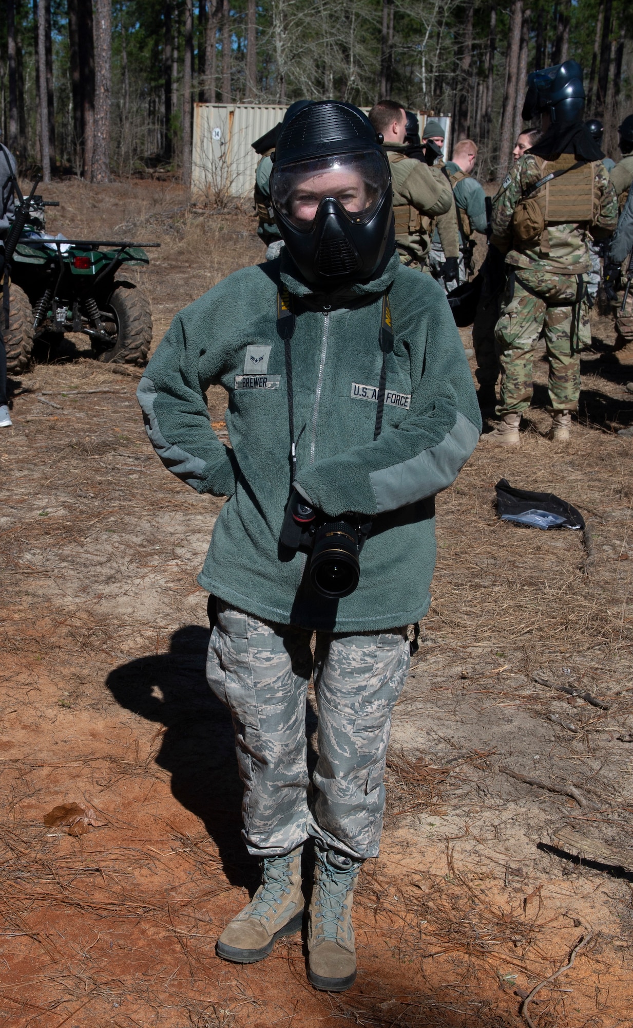U.S. Air Force Airman 1st Class Kaitlyn Brewer stands with a gas mask for 20th Security Forces Squadron training in Sumter, S.C., March 6, 2019.