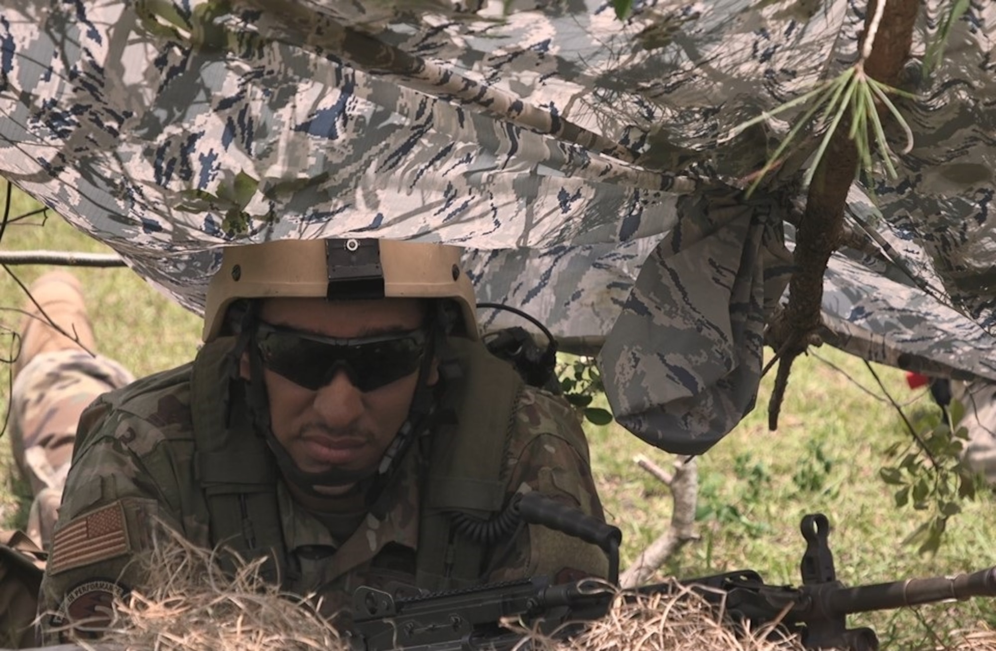 Senior Airman Darian Betancourt, 4th Fighter Wing aircraft armament systems specialist, observes the airfield perimeter from a defensive fighting position May 9, 2019, at Kinston Regional Jetport, North Carolina.