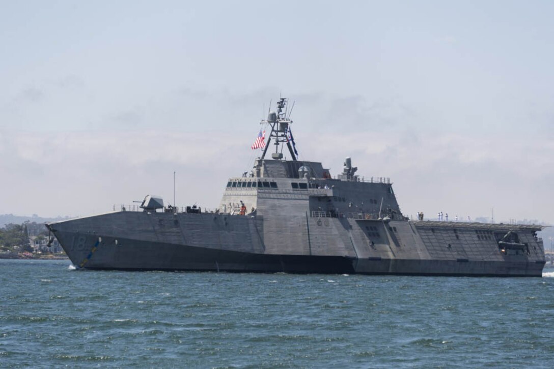 Navy combat ship sails in San Diego Bay.