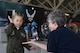 Secretary of the Air Force Heather Wilson receives a high-five from a child during the Joint Base Andrews 2019 Air and Space Expo at Joint Base Andrews, Maryland, May 10, 2019 while visiting the MQ-9 Reaper. The MQ-9 Reaper was a static display at this year’s show celebrating legends in flight. (U.S. Air Force photo by Airman 1st Class Haley Stevens)