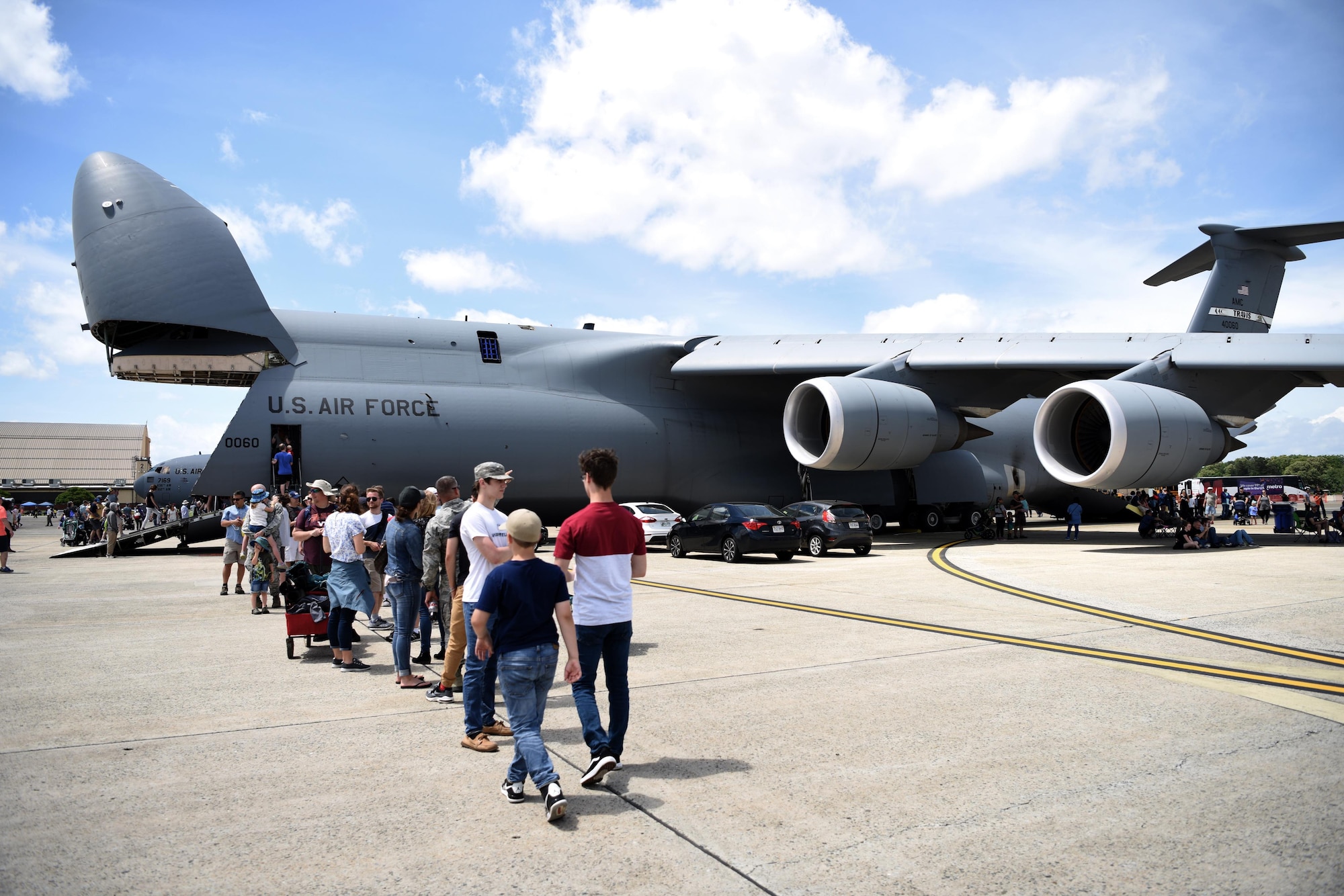 Spectators wait to explore the C-5 Galaxy at the Joint Base Andrews 2019 Air and Space Expo at Joint Base Andrews, Maryland, May 10, 2019. Displayed among aircraft like the T-38 Talon and C-5 Galaxy, the MQ-9 Reaper was the only Remotely Piloted Aircraft in attendance during this year’s airshow. (U.S. Air Force photo by Airman 1st Class Haley Stevens)