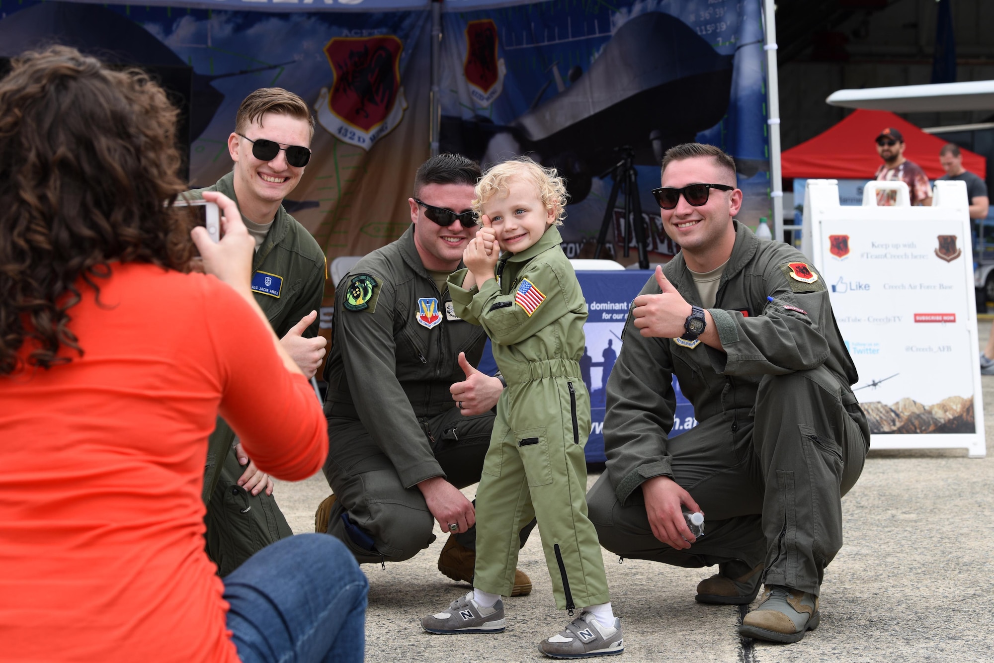 Aircrew assigned to the 432nd Wing at Creech Air Force Base, Nevada, pose for a photo during the Joint Base Andrews 2019 Air and Space Expo at Joint Base Andrews, Maryland, May 11, 2019. The aircrew is made up of a commissioned pilot in command of the aircraft during all phases of flight and an enlisted aviator sensor operator responsible for operating the aircraft’s Multi-Spectral Targeting System. (U.S. Air Force photo by Capt. Annabel Monroe)