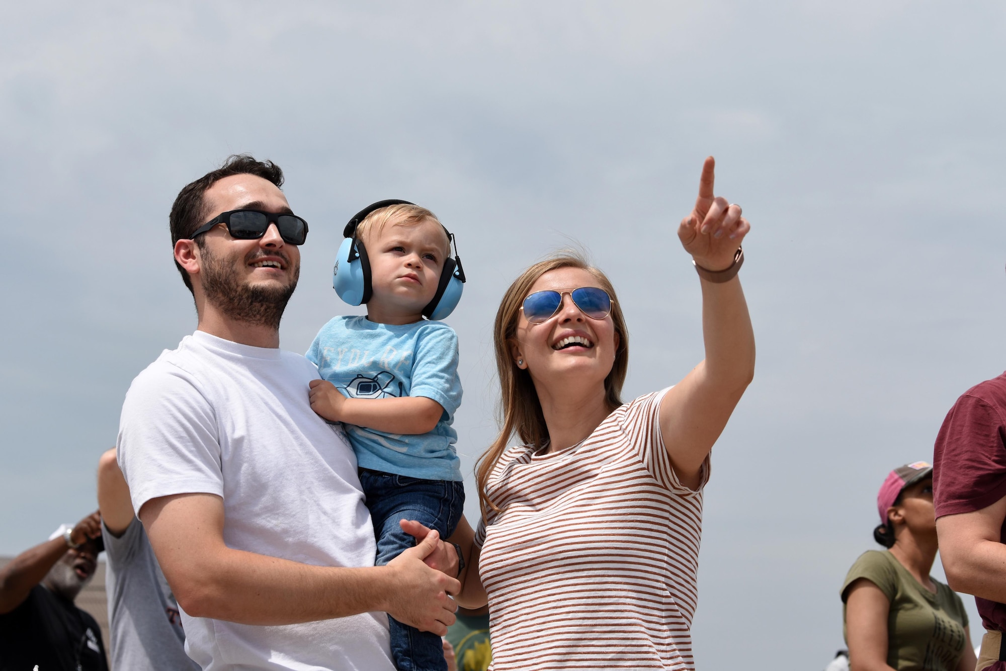 A family watches the United States Air Force Thunderbirds during the Joint Base Andrews 2019 Air and Space Expo at Joint Base Andrews, Maryland, May 11, 2019. The MQ-9 Reaper was a static display at this year’s show celebrating legends in flight. (U.S. Air Force photo by Capt. Annabel Monroe)