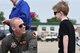 Capt. Kyle, 17th Attack Squadron MQ-9 Reaper pilot, talks with an air show attendee during the Joint Base Andrews 2019 Air and Space Expo on Joint Base Andrews, Maryland, May 10, 2019. The MQ-9 was a static display at this year’s show celebrating legends in flight. (U.S. Air Force photo by Airman 1st Class Haley Stevens)