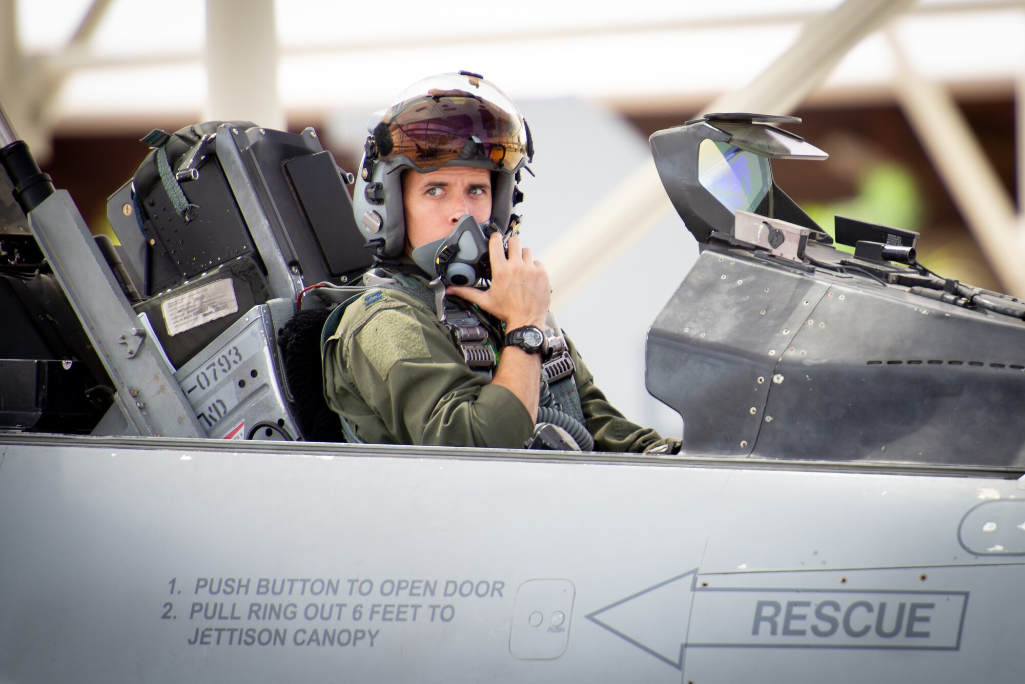 Capt. Kyle Moses, 310th Fighter Squadron instructor pilot, waits in the cockpit of an F-16D Fighting Falcon at Luke Air Force Base, Ariz., May 10, 2019. Moses flew alongside his sister Capt. Kaleigh Moses, 56th Medical Operations Squadron nurse practitioner, who sat in the backseat of his wingman’s jet during a familiarization flight. (U.S. Air Force photo by Staff Sgt. Jensen Stidham)