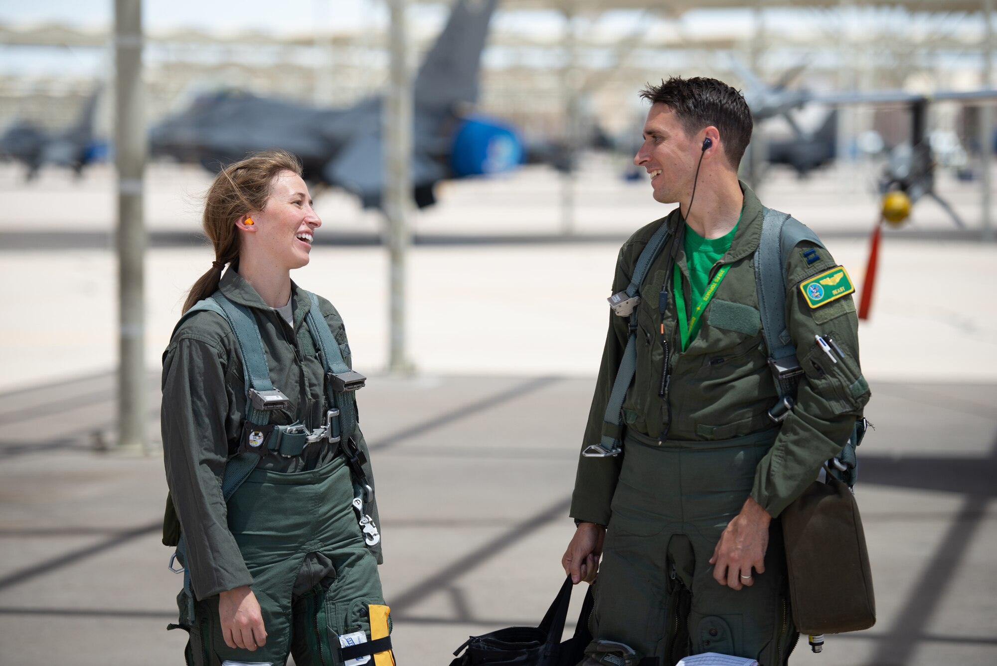 Capt. Kaleigh Moses (left), 56th Medical Operations Squadron nurse practitioner, smiles at her brother Capt. Kyle Moses, 310th Fighter Squadron instructor pilot, after a flight in an F-16D Fighting Falcon at Luke Air Force Base, Ariz., May 10, 2019. Kaleigh flew alongside her sibling during a flight to help her understand how the contributions she makes as a nurse practitioner directly affects the pilots who teach and train the world’s greatest fighter pilots. (U.S. Air Force photo by Staff Sgt. Jensen Stidham)