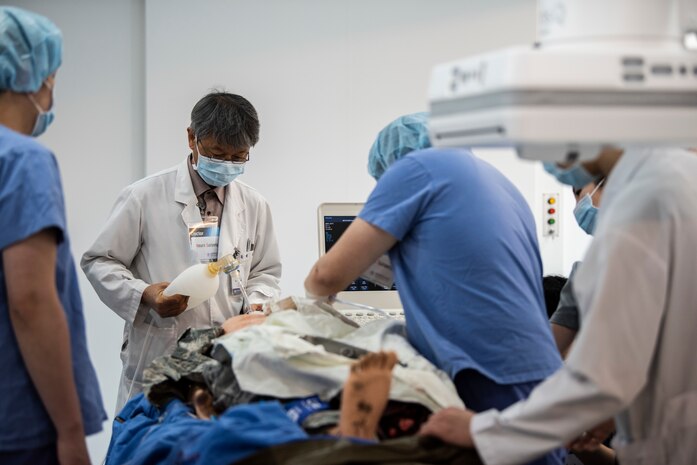 Medical staff perform surgery on a simulated patient at Wonkwang University Medical Center, Republic of Korea, May 8, 2019. The 8th Medical Group used an advanced mannequin to hone the skills of the surgical staff and streamline the emergency air lift from Kunsan Air Base to the hospital (U.S. Air Force photo by Senior Airman Stefan Alvarez)