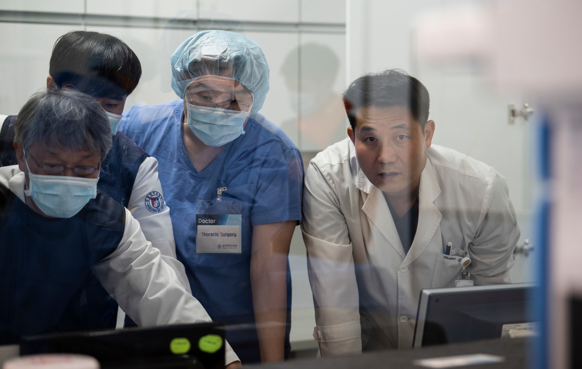 Medical staff observe surgery on a simulated patient at Wonkwang University Medical Center, Republic of Korea, May 8, 2019. The 8th Medical Group coordinated with the surgical team at Wonkwang to operate on a simulated patient from Kunsan Air Base and test the effectiveness of an emergency air lift from the base to the hospital. (U.S. Air Force photo by Senior Airman Stefan Alvarez)