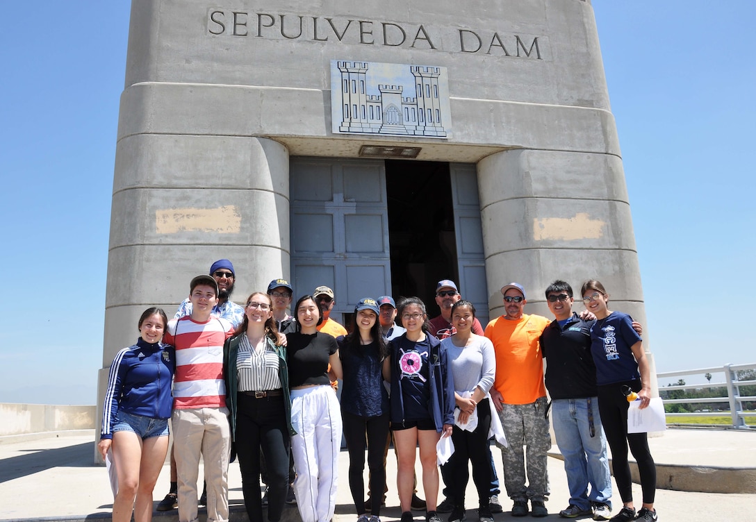 About a dozen University of California, Los Angeles, students pose for a picture with U.S. Army Corps of Engineers Los Angeles District employees April 25, following a tour of Sepulveda Dam Spillway in Los Angeles. The students learned about the dam’s operations, hydrology and design, as well as information about careers with the Corps.