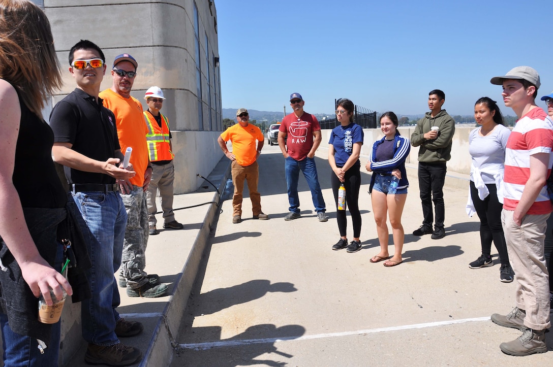 Reuben Sasaki, hydraulic engineer, Hydrology and Hydraulics Branch, Engineering Division, U.S. Army Corps of Engineers Los Angeles District, second from left, talks about the hydrology of the Sepulveda Dam with about a dozen University of California, Los Angeles students during an April 25 tour of the dam’s spillway in Los Angeles.