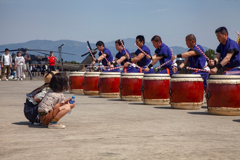 Children watch the Takigahara Taiko Drummers play for the Friendship Festival May 11, 2019, on Combined Arms Training Center Camp Fuji, Shizuoka, Japan.