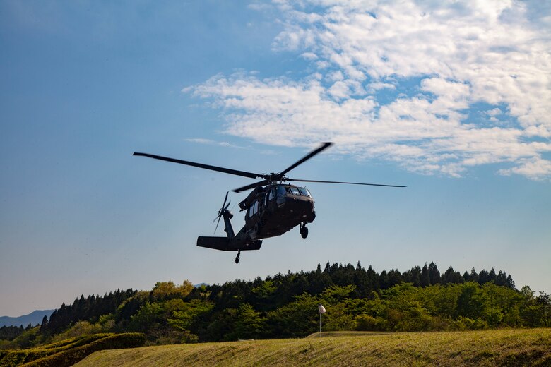 Festival attendees gather to watch a Japan Ground Self-Defense Force UH-60 Blackhawk helicopter take off during the Friendship Festival May 11, 2019, on Combined Arms Training Center Camp Fuji, Shizuoka, Japan.