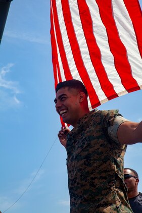 LCpl. Alberto Salceda, a native from Orange County Calif. and LCpl. Cody Rhinehart, a native from Fort Lauderdale Fla., with 3rd Battalion 12th Marines, Camp Lejuene, help raise the American flag during the Friendship Festival May 11, 2019, on Combined Arms Training Center Camp Fuji, Shizuoka, Japan.