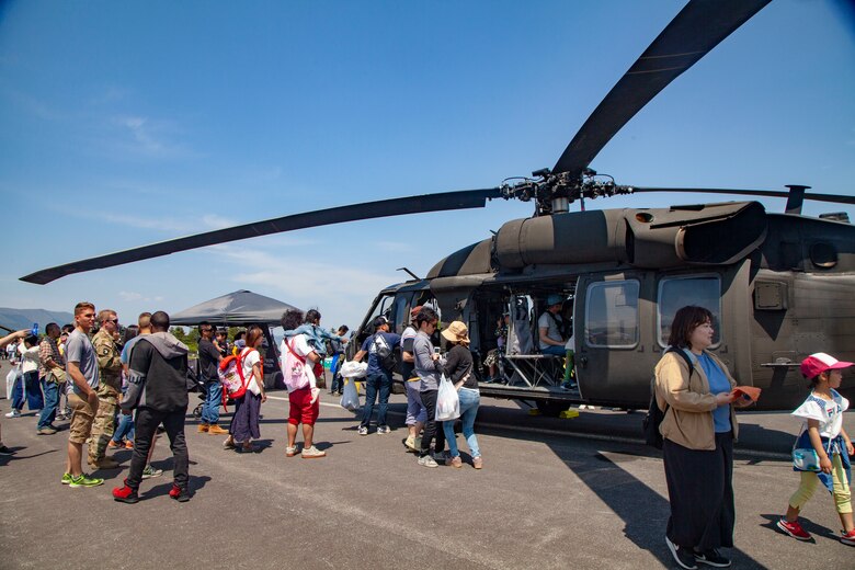 Festival attendees tour a Japan Ground Self-Defense Force UH-60 Blackhawk helicopter static display during the Friendship Festival May 11, 2019, on Combined Arms Training Center Camp Fuji, Shizuoka, Japan.