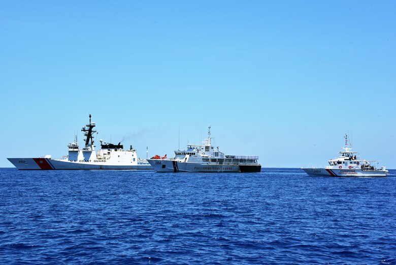 SOUTH CHINA SEA (May 14, 2019) - The U.S. Coast Guard Cutter Bertholf (WMSL 750), left, moves in formation with the Philippine Coast Guard vessels Batangas, center, and Kalanggaman during an exercise. Bertholf is in the midst of a Western Pacific patrol under the tactical control of the U.S. Navy’s 7th Fleet. 