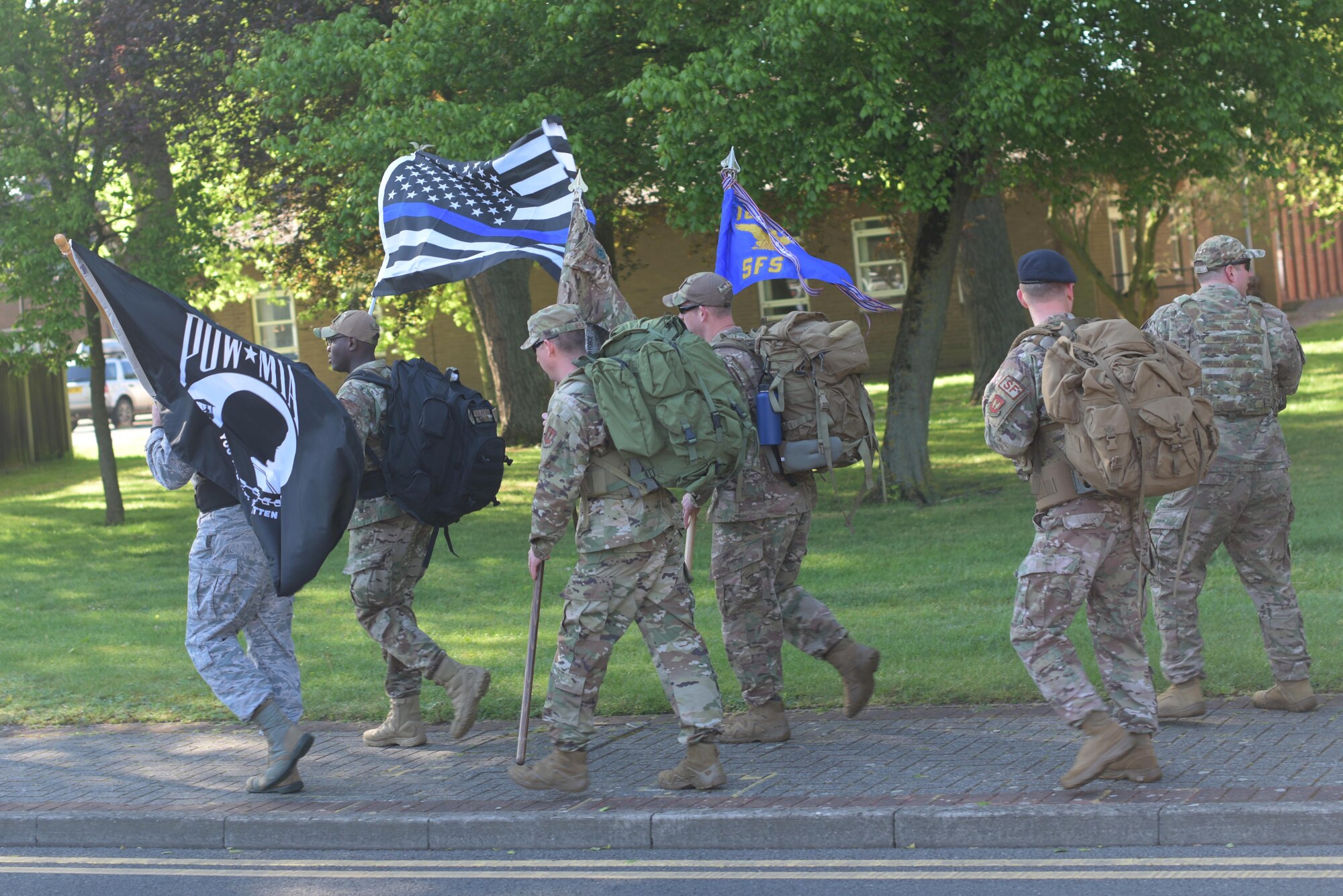 Members of the 100th and 48th Security Forces Squadrons participate in a ruck march at RAF Mildenhall, England, May 13, 2019. The week of May 15, is designated National Police Week and honors fallen law enforcement officers. (U.S. Air Force photo by Senior Airman Benjamin Cooper)