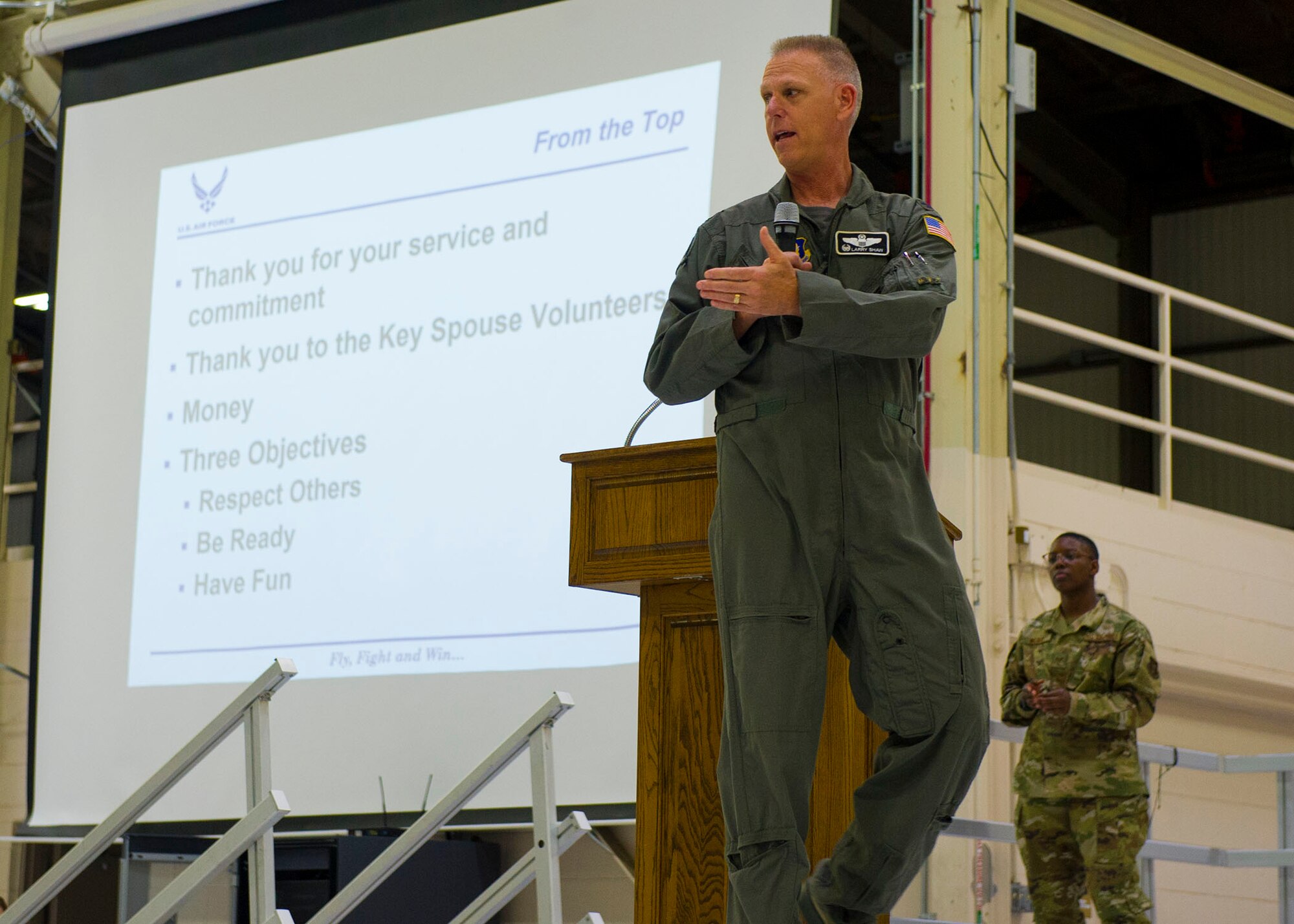 U.S. Air Force Col. Larry Shaw, highlights the importance of teamwork during a commander's call at Grissom Air Force Base, Ind., May. 4, 2019. During the all-call, Shaw reviewed Grissom's mission and vision, as well as his expectations for the busy year in regards to exercises and inspections. (U.S. Air Force photo by Staff Sgt. Courtney Dotson-Essett)