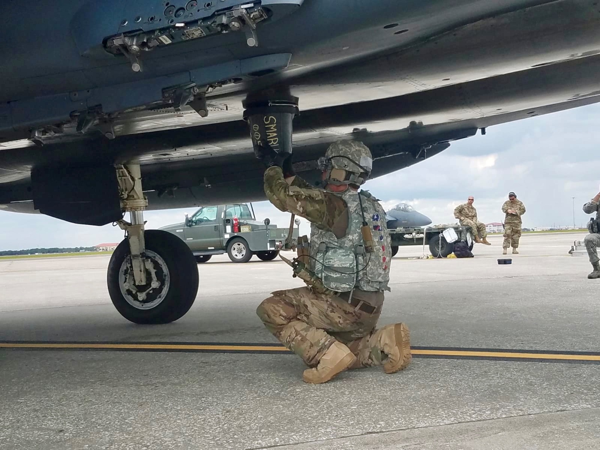 Tech. Sgt. Steven Wilson, 4th Logistics Readiness Squadron air transportation craftsman, performs hot-pit refueling of an F-15E during the Combat Support Wing capstone, May 9, 2019, at MacDill Air Force Base, Florida.