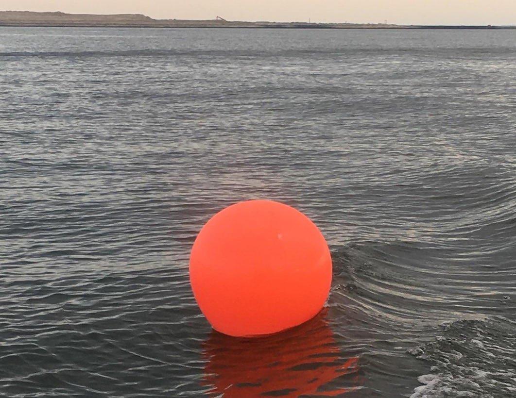 An orange ball buoy is shown to warn boaters of the navigation hazards located within the construction zone off of Poplar Island. This construction is part of Baltimore District’s Poplar Island expansion project, which is a partnership with the Maryland Port Administration, to create an additional 575 acres of remote island habitat using clean material dredged from the Maryland Chesapeake Bay approach channels to the Port of Baltimore.