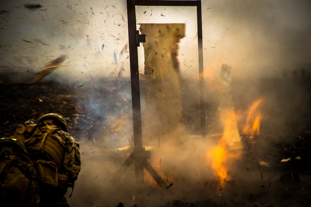 U.S. Marines with Combat Assault Company, attached to 2nd Battalion, 3rd Marine Regiment, conduct demolition breaching tactics during Exercise Bougainville II on Range 9, Pohakuloa Training Area, Hawaii, May 12, 2019. Bougainville II is the second phase of pre-deployment training conducted by the battalion in order to enhance unit cohesion and combat readiness.