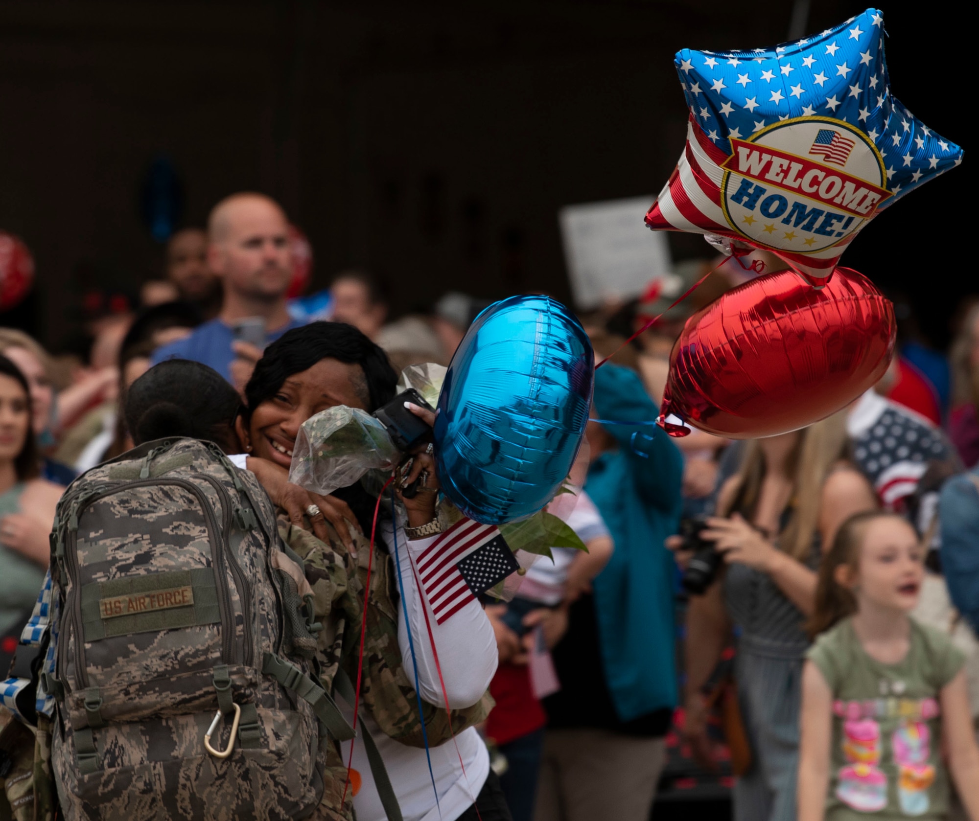 A U.S. Airman embraces a loved one on Shaw Air Force Base, S.C.  May 4, 2019.