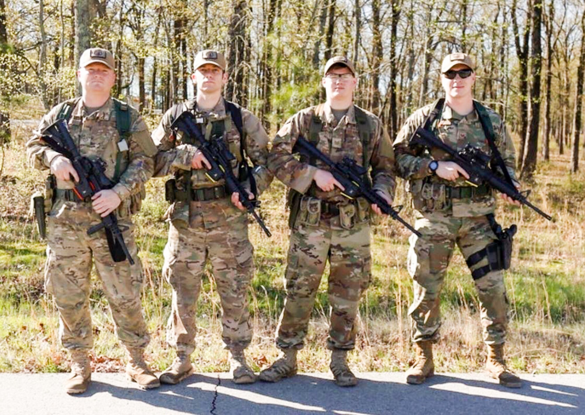 The Western Air Defense Sector marksmanship team poses for a team picture during the 2019 Winston P. Wilson Championship, Robinson Maneuver Training Center, Arkansas, April 10, 2019.  Pictured from left to right: Master Sgt. Eric Poe, 225th Support Squadron; Master Sgt. Shay Brockman, 225th Air Defense Squadron; Tech. Sgt. Cameron Riedl, 225th ADS; and Staff Sgt. Shane Key, 225th SS.  (Courtesy photo by Staff Sgt. Shane Key)