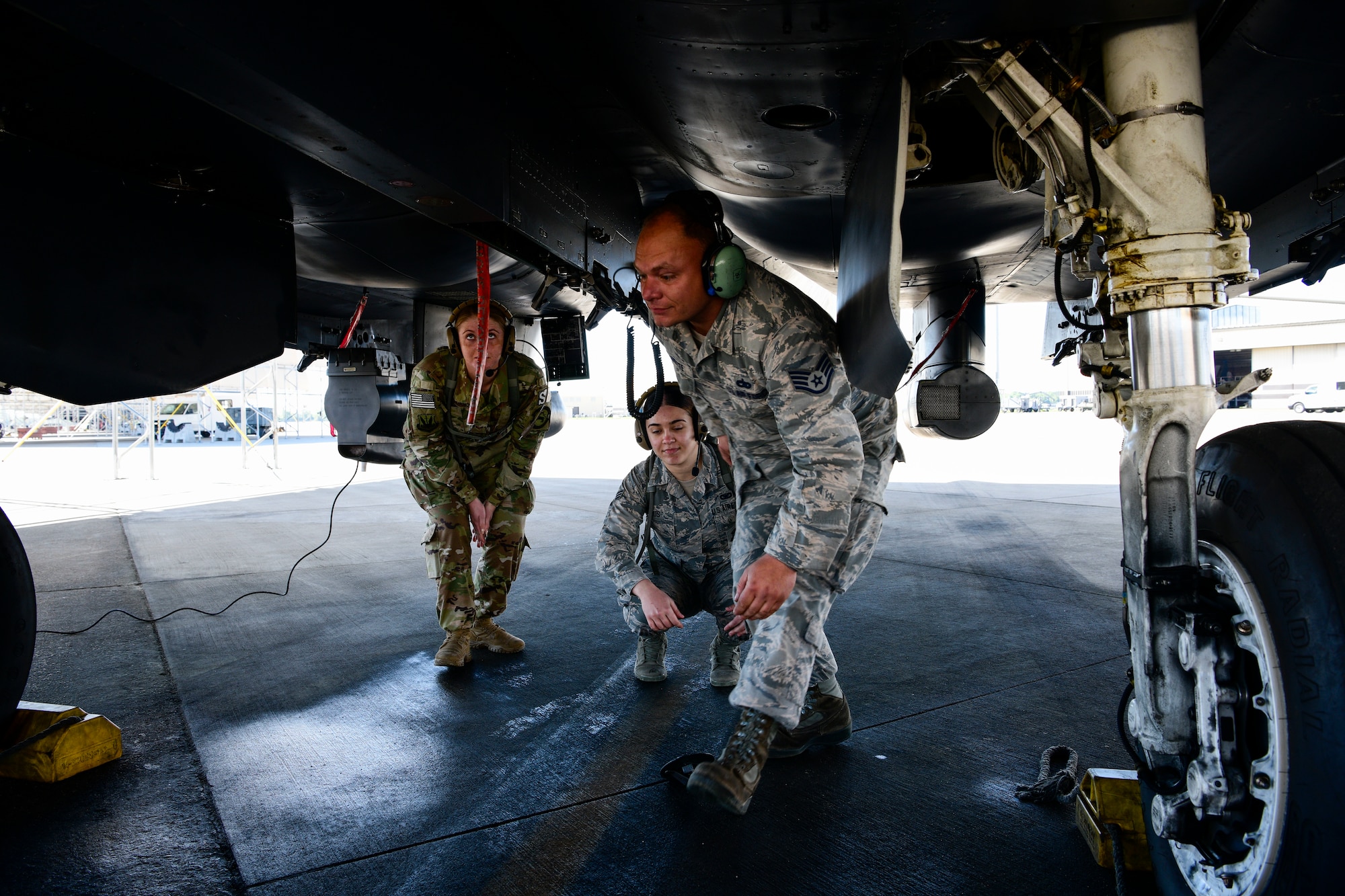 Staff Sgt. Joshua Jennette, 336th Aircraft Maintenance Unit avionics lead, instructs two defenders from the 4th Security Forces Squadron on different parts of the F-15E Strike Eagle during the Combat Support Wing exercise, April 17, 2019, at Seymour Johnson Air Force Base, North Carolina. 110 Airmen from 15 bases participated in the exercise. (U.S. Air Force photo by Senior Airman Kenneth Boyton)