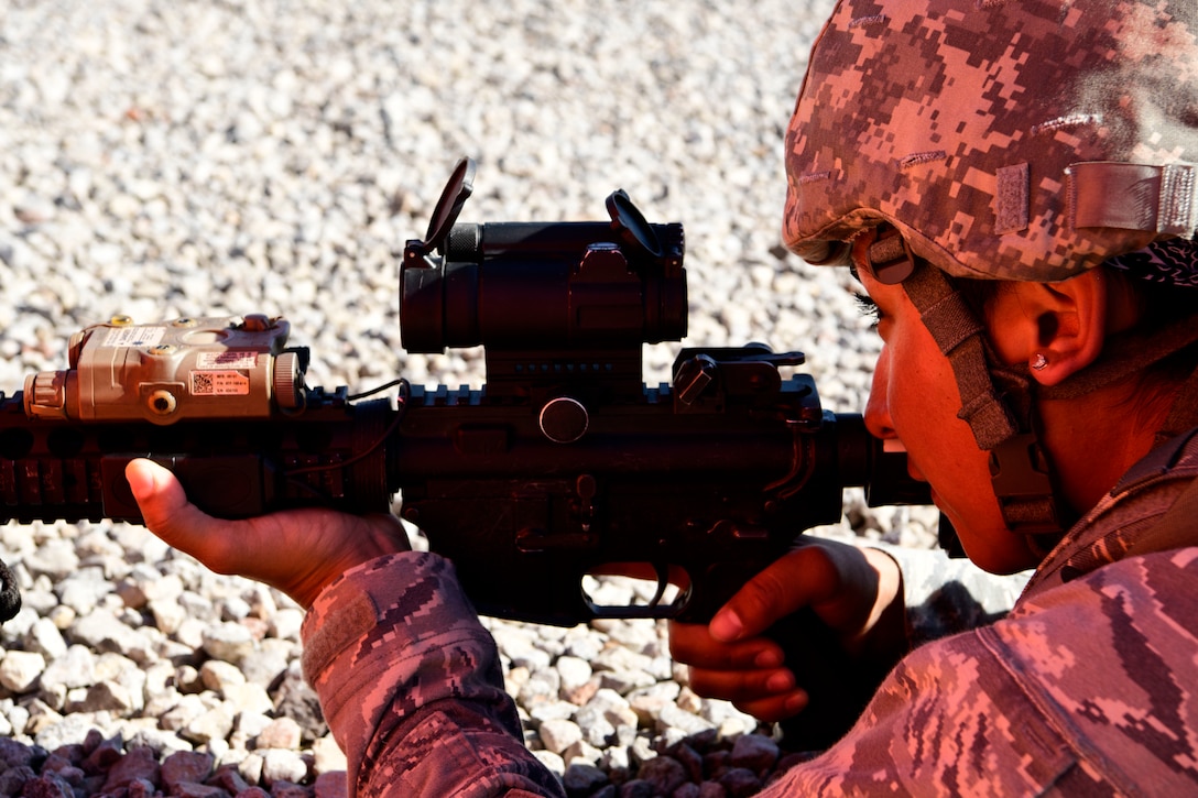 Tech. Sgt. Maxine Mikulak, 4th Security Forces Squadron flight sergeant, provides security during the Combat Support Wing exercise, May 3, 2019, at Fort Bliss, Texas. During the exercise, Airmen received training on tactfully moving, shooting and communicating, how to provide Tactical Combat Casualty Care, and perimeter defense. (U.S. Air Force photo by Senior Airman Kenneth Boyton)