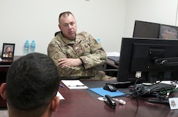 Col. Gregory Toth, director of 3d Human Resources Sustainment Center, speaks to a Soldier at Camp Arifjan, Kuwait, April 10, 2019.