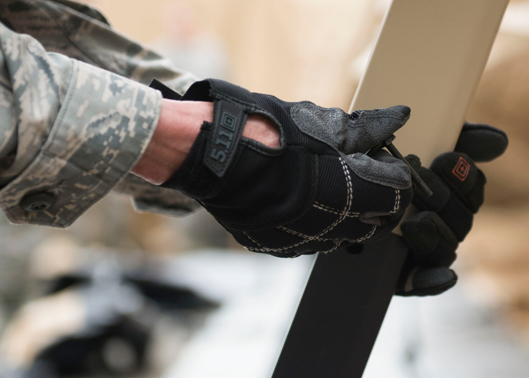 An Airman secures a tent post, May 6, 2019 at Joint Base Langley-Eustis, Virginia.
