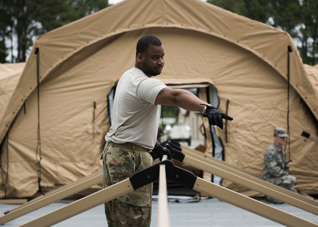 A Global Response Force lead trains his team on configuring tents, May 6, 2019 at Joint Base Langley-Eustis, Virginia.