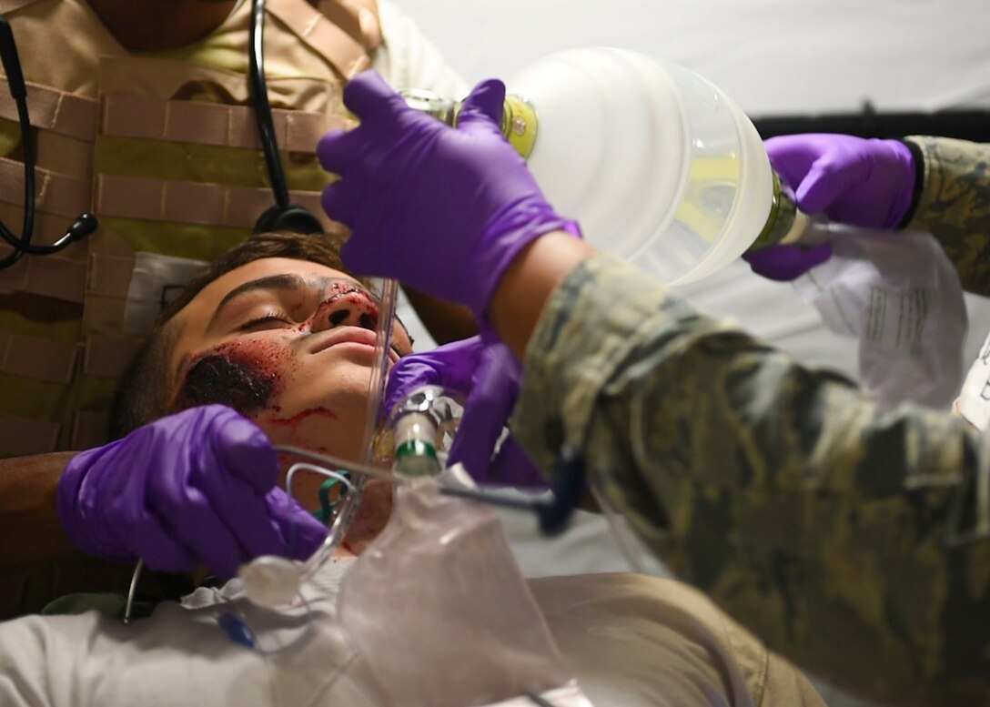 An Expeditionary Medical Support exercise player gets medical care, May 9, 2019 at Joint Base Langley-Eustis, Virginia.