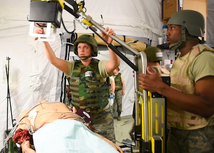 Players in the Expeditionary Medical Support exercise X-ray a mannequin May 9, 2019 at Joint Base Langley-Eustis, Virginia.