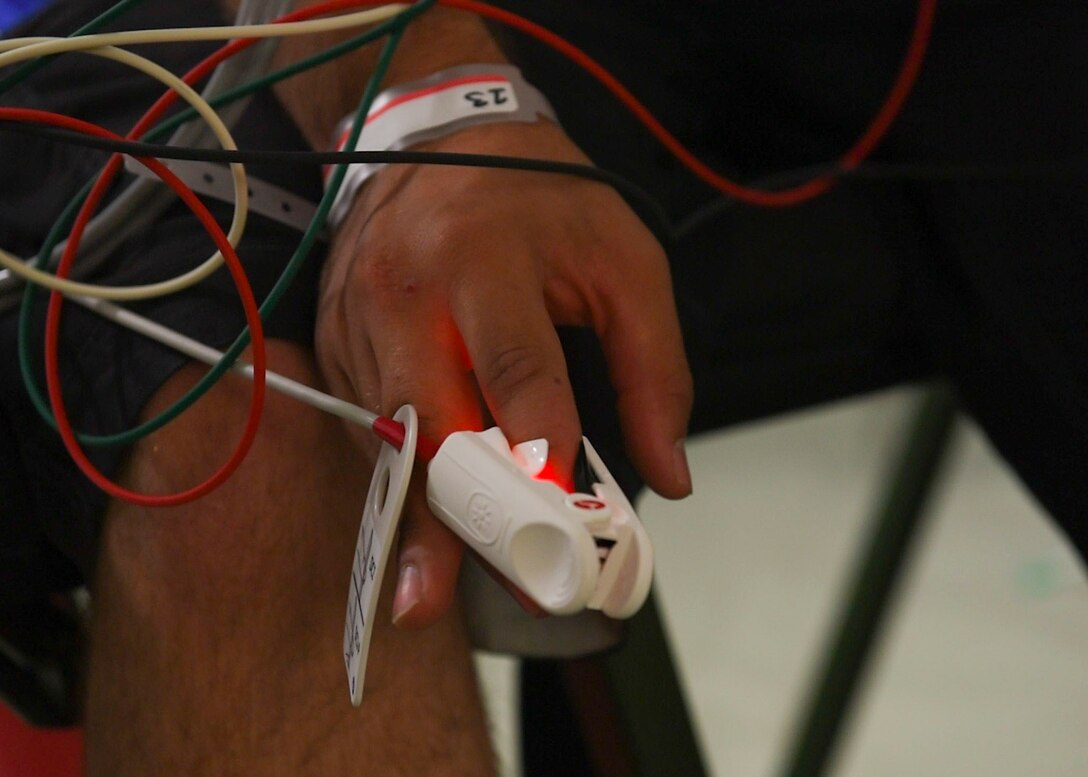 A patient in the Expeditionary Medical Support exercise gets his pulse checked, May 9, 2019 at Joint Base Langley-Eustis, Virginia.