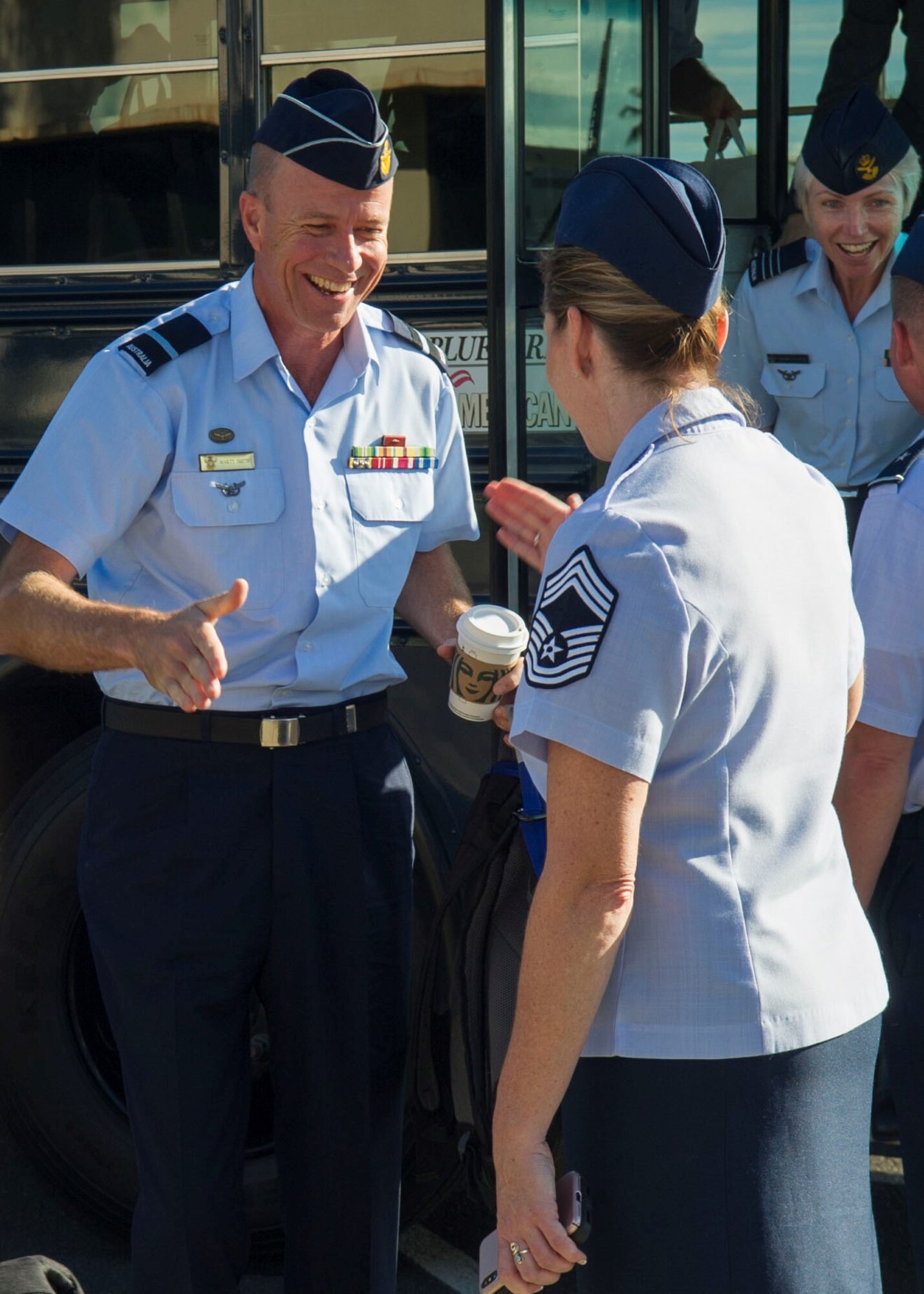 Chief Master Sgt. Jennifer Hutcherson, assigned to Headquarters Pacific Air Forces Operations branch, greets Royal Australian Air Force Air Commodore Martin Smith in front of the PACAF building on Joint Base Pearl Harbor-Hickam, Hawaii, May 8, 2019.