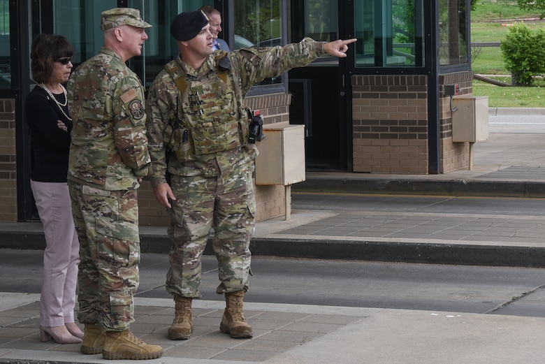 Master Sgt. Matthew Treadwell, 22nd Security Forces Squadron flight leader, discusses the barrier system with Maj. Gen. Sam Barrett, 18th Air Force commander and his wife, Mrs. Kelly Barrett, May 2, 2019, at McConnell Air Force Base, Kan. Gen. Barrett and Mrs. Kelly Barrett visited McConnell to learn more about the base and the challenges the Airmen face. (U.S. Air Force photo by Airman 1st Class Alexi Myrick)