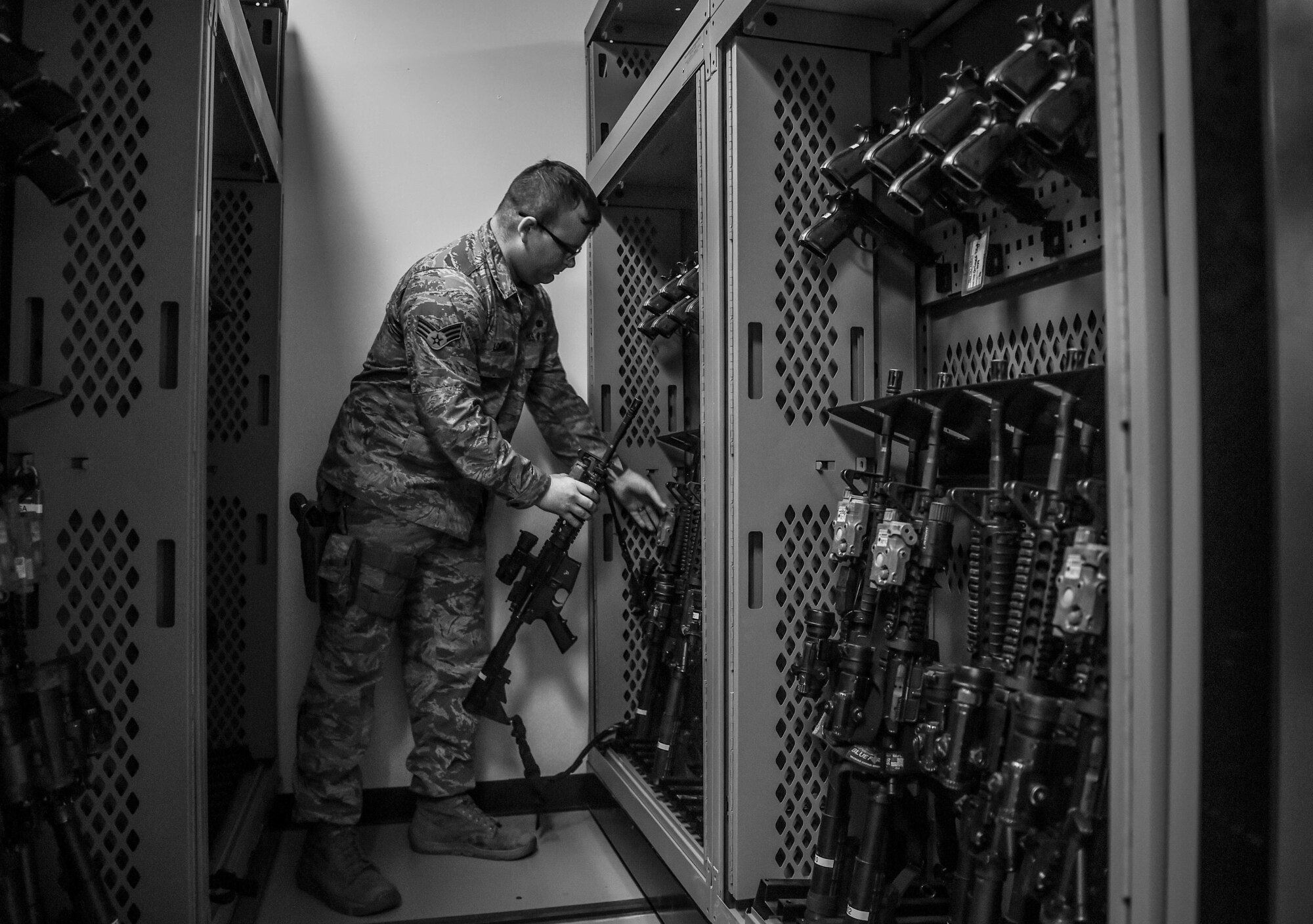 U.S. Air Force Senior Airman Cory Loicao, 627th Security Forces Squadron flight armorer, returns an M-16 rifle to the new armory rack system installed at the squadron’s armory as a part of the Reconstitute Defender Initiative (RDI) at Joint Base Lewis-McChord, Wash., April 30, 2019. Air Force leaders declared 2019 the – Year of the Defender – and committed to implementing the RDI to provide better funding and opportunities to security forces squadrons throughout the Air Force.  (U.S. Air Force photo by Senior Airman Tryphena Mayhugh)