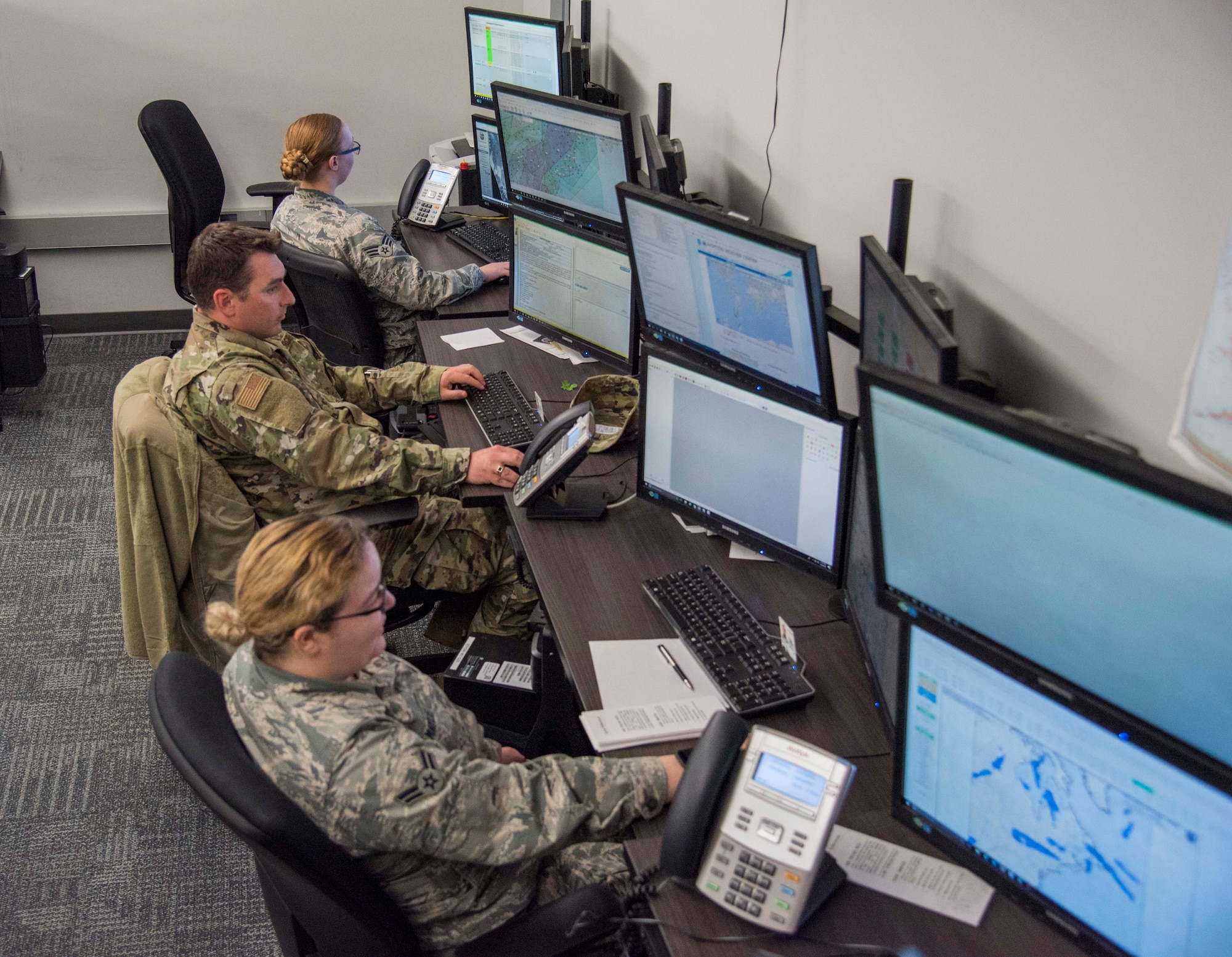 Airmen from the 15th Operational Weather Squadron monitor weather systems and patterns to help them better forecast upcoming weather that might affect various bases and their missions. The 15th OWS monitors weather to brief pilots about weather they might experience on their upcoming flight and send severe weather alerts to military bases if necessary. (U.S. Air Force photo by Airman 1st Class Nathaniel Hudson)
