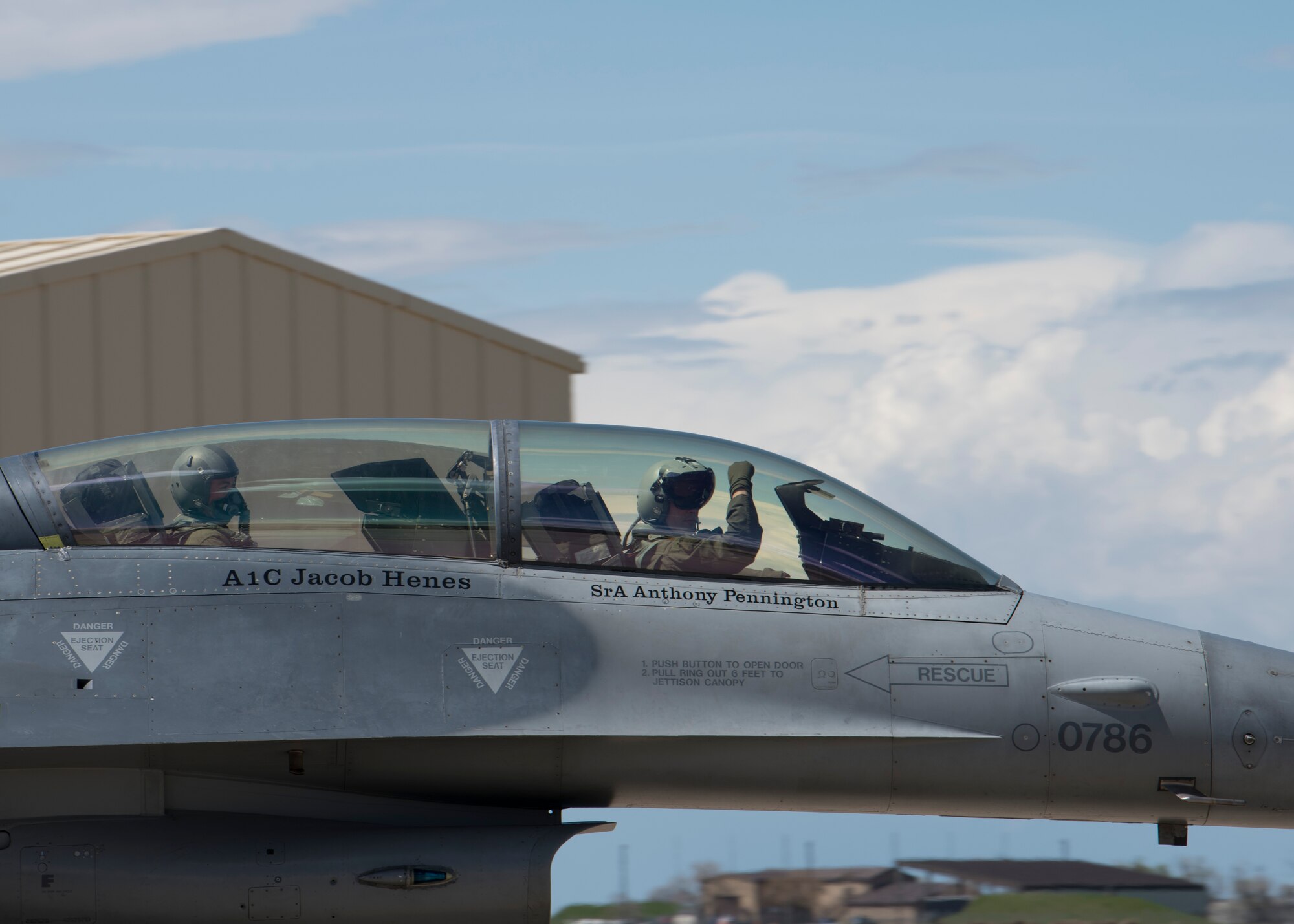 A 311th Fighter Squadron F-16 Viper pilot displays the squadron “Fangs Out” symbol as he taxis before takeoff, April 24, 2019, on Hill Air Force Base, Utah. Between April 22 and May 3, the 311th FS conducted 174 sorties in support of student pilot training and dissimilar air combat training with the F-35 Lightning II. (U.S. Air Force photo by Staff Sgt. BreeAnn Sachs)
