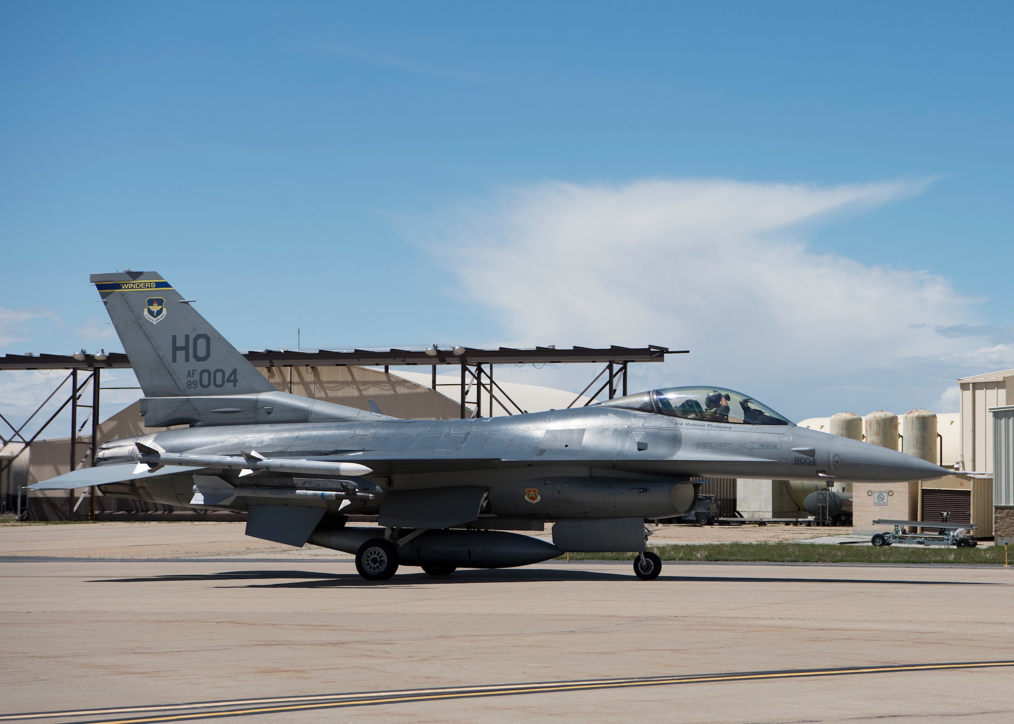 A 311th Viper F-16 Viper pilot displays the squadron “Fangs Out” symbol while taxiing, April 24, 2019, on Hill Air Force Base, Utah. The 311th FS brought 16 F-16 D-models to provide Familiarization Flights to 40 operations and maintenance personnel during exercise Viper Venom 19-01. (U.S. Air Force photo by Staff Sgt. BreeAnn Sachs)