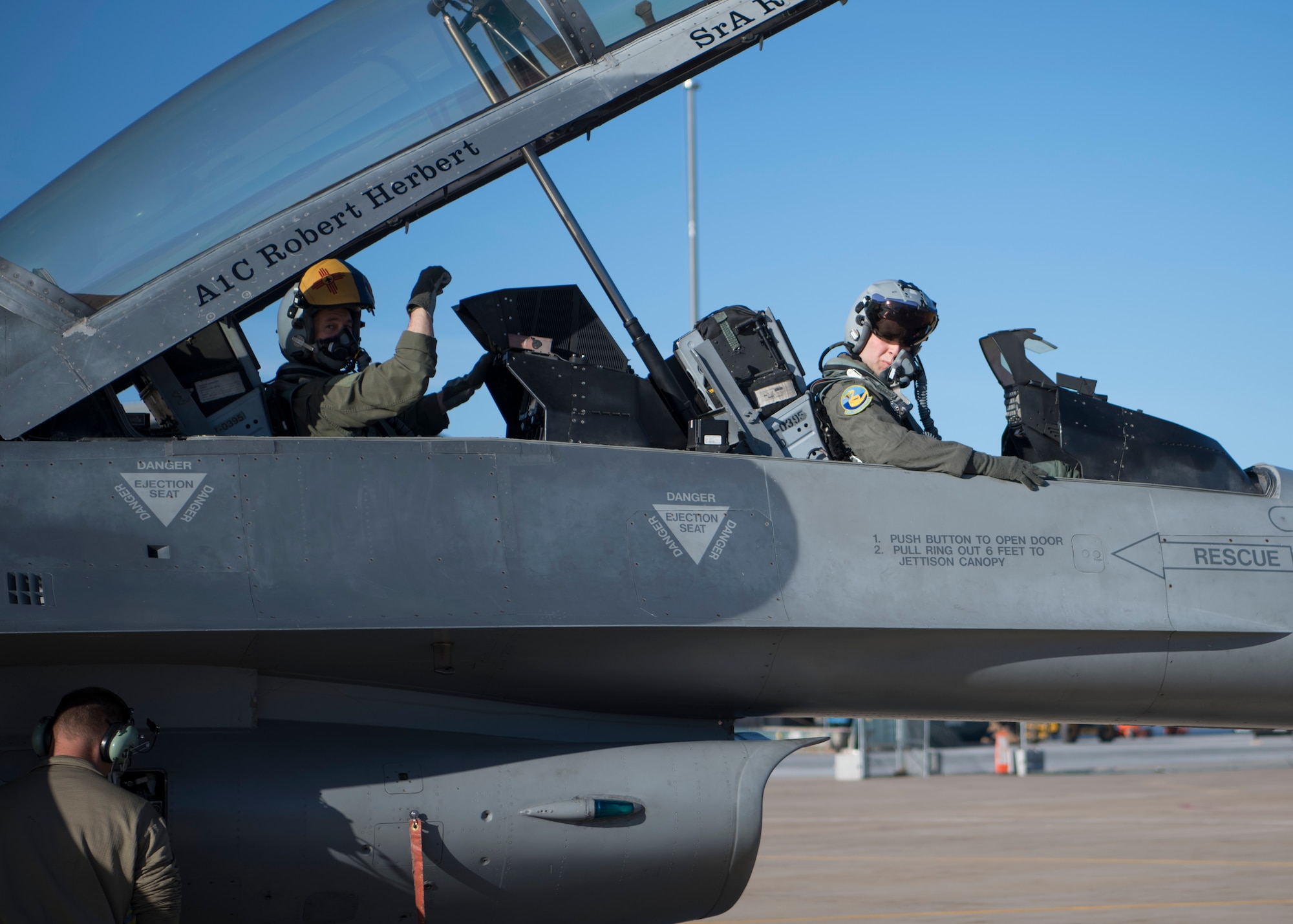 An Airman displays the 311th Fighter Squadron “Fangs Out” symbol before a familiarization flight, April 25, 2019, on Hill Air Force Base, Utah. Forty operations and maintenance personnel were given FAM flights during exercise Venom 19-01. (U.S. Air Force photo by Staff Sgt. BreeAnn Sachs)