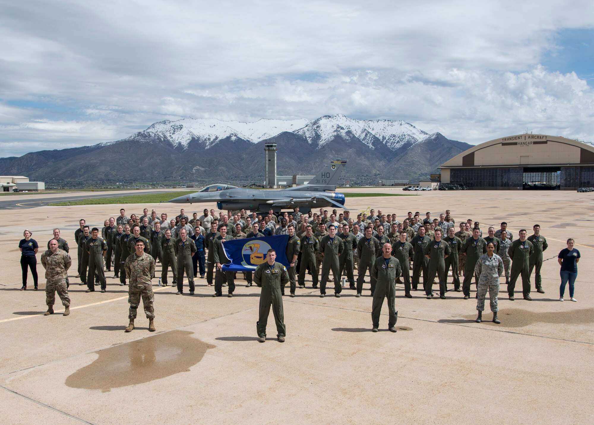 Members of the 311th Fighter Squadron pose for a squadron photo, April 25, 2019, on Hill Air Force Base, Utah. Between April 22 and May 3, the 311th FS conducted 174 sorties in support of student pilot training and dissimilar air combat training with the F-35 Lightning II. (U.S. Air Force photo by Staff Sgt. BreeAnn Sachs)