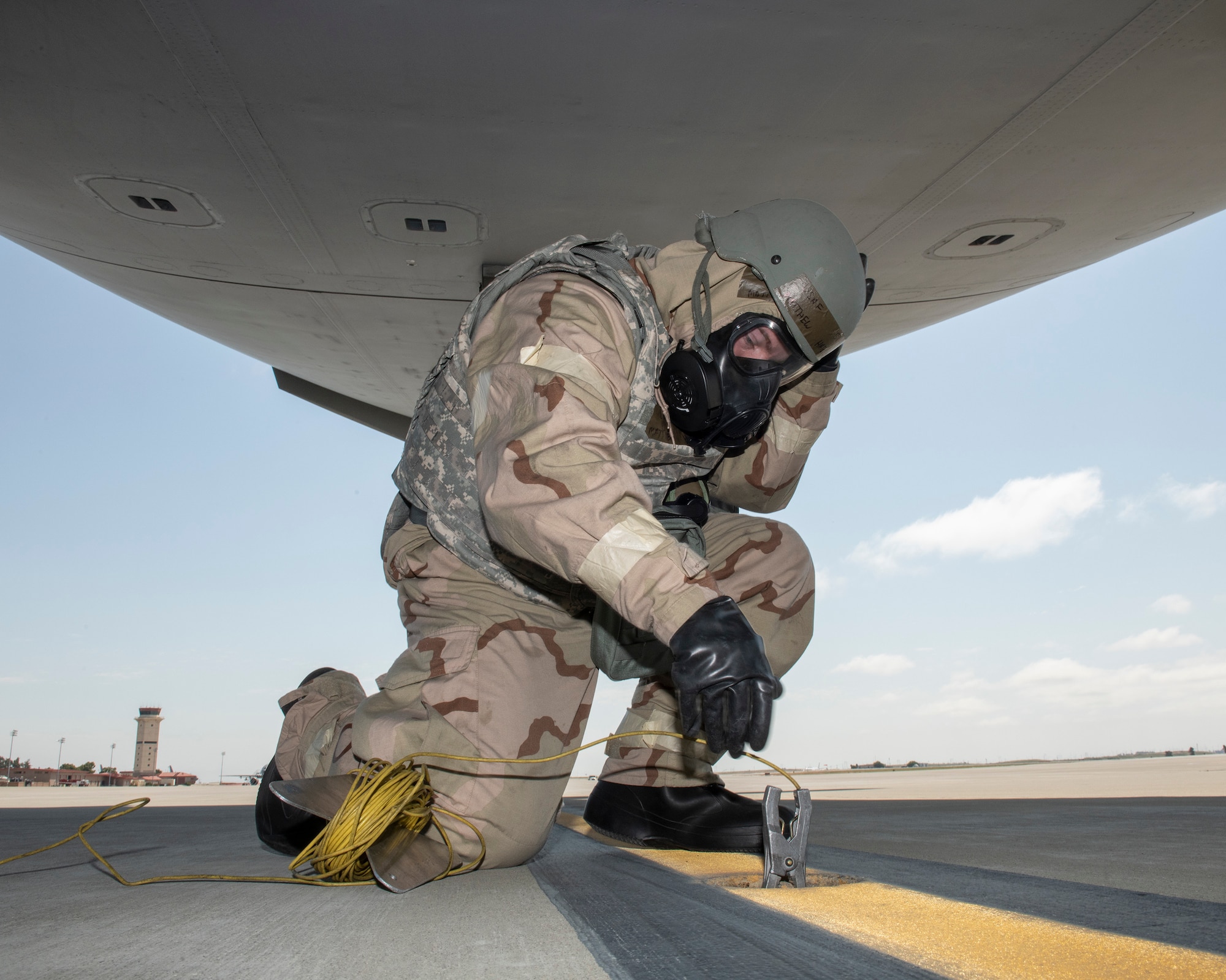 U.S. Air Force Senior Airman Matthew Hatcher, 860th Aircraft Maintenance Squadron, grounds a C-17 Globemaster III during a readiness exercise at Travis Air Force Base, California, May 9, 2019. The base conducted a week-long exercise that evaluated Travis’ readiness and ability to execute and sustain rapid global mobility around the world. (U.S. Air Force photo by Louis Briscese)