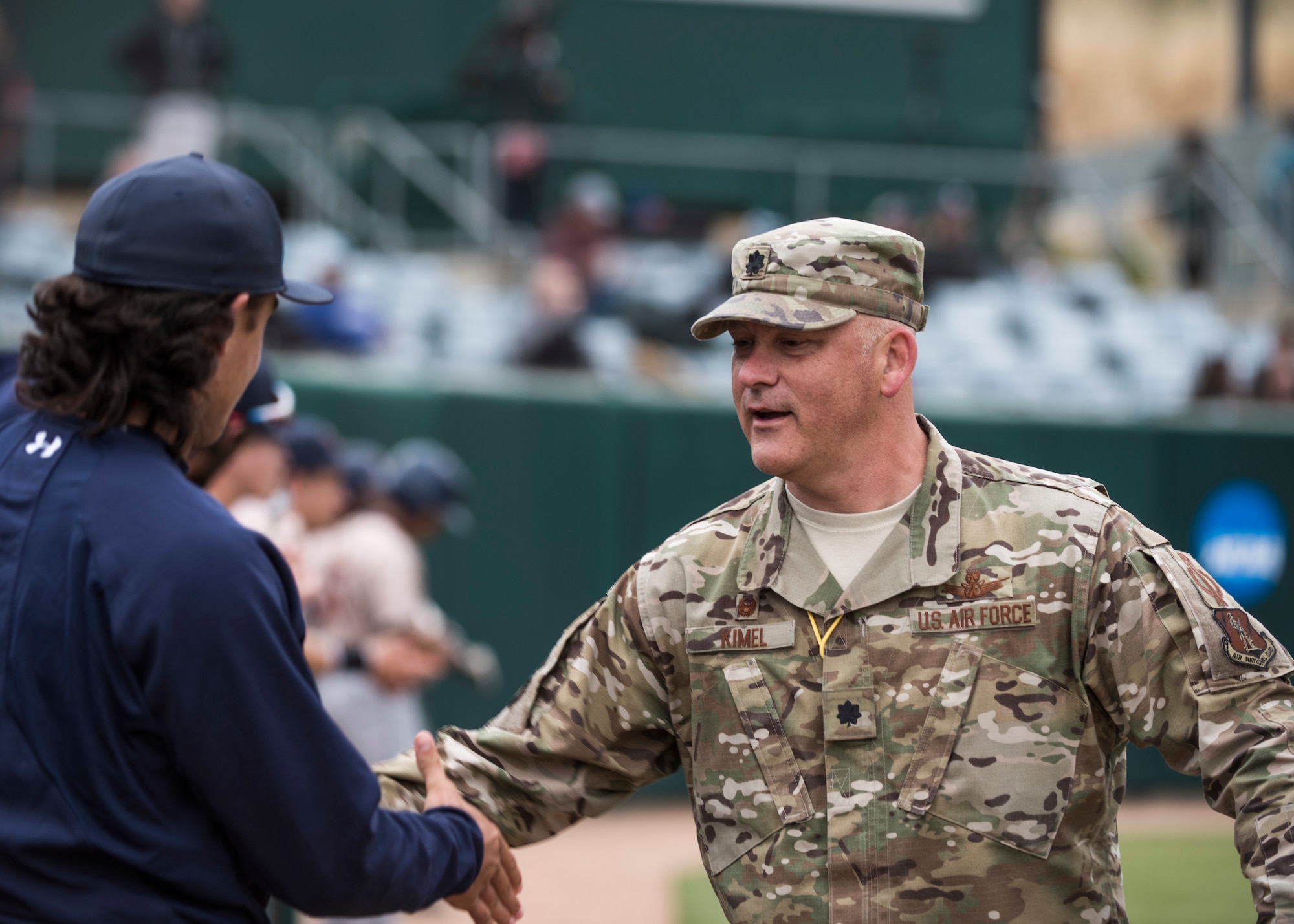 Lt. Col. Steven Kimel, 216th Space Control Squadron commander, greets members of the California Polytechnic State University Hero’s Night baseball team May 7, 2019, at the Alex G. Spanos Stadium at in San Luis Obispo, Calif. Kimel was invited to throw the first pitch during Hero’s Night as a way for the community to show appreciation to their local heroes. (U.S. Air Force photo by Airman 1st Class Aubree Milks)