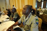 U.S. Africa Command partner from Gabon participating in Africa Endeavor 2017 sits in on briefing during weeklong event in Lilongwe, Malawi, August 21, 2017 (U.S. Navy/Dominique Shelton)