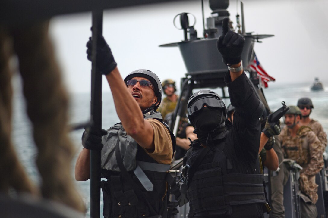 Special forces from Gulf Cooperation Council nation attempt to hook boarding ladder onto U.S. Army vessel “Corinth” during visit, board, search, and seizure training in Arabian Gulf during exercise Eagle Resolve, March 17, 2015 (U.S. Air Force/Kathryn L. Lozier)
