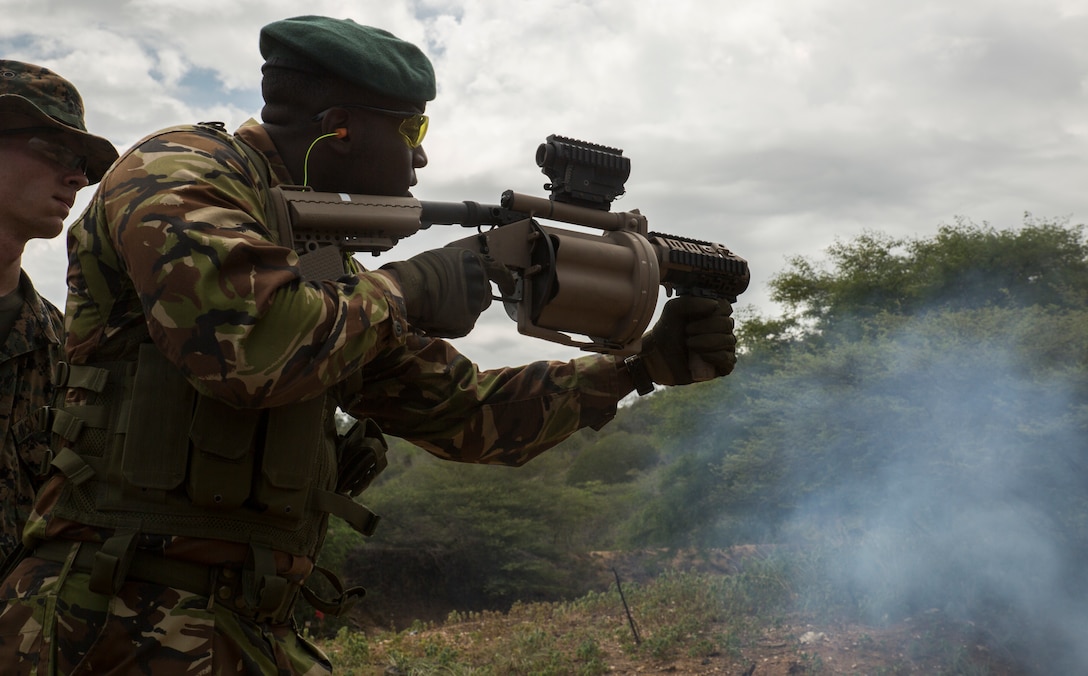 Barbados servicemember shoots nonlethal rounds with M32 grenade launcher during exercise Tradewinds 2016, at Twickenham Park Gallery Range, Jamaica, June 24, 2016 (U.S. Marine Corps/Justin T. Updegraff)